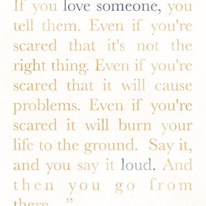 May include: A print with a cream-colored background and text in a mix of gold and blue. The quote reads, "If you love someone, you tell them... Say it, and you say it loud. And then you go from there..."