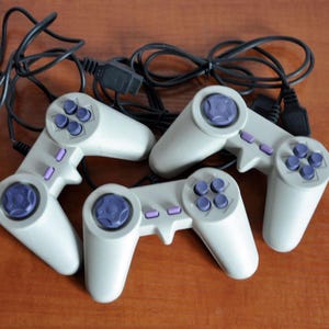 Vintage JX-106 Joysticks: 2000s 8-Bit Gaming Controllers - Set of 3