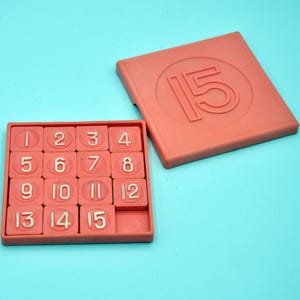 Vintage plastic logic game 15 slide puzzle, the 1980s