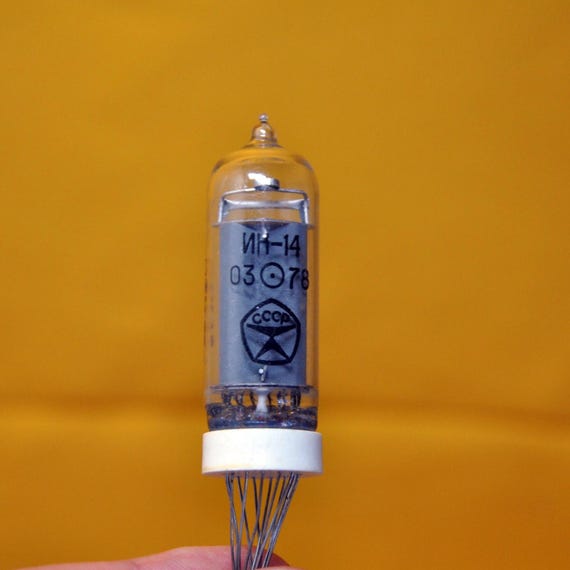 A genuine NOS 1978 Soviet IN-14 Nixie tube — the actual glowing component, a piece of Cold War electronics history you can hold (or build with).