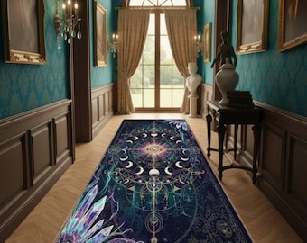May include: A rectangular area rug with a celestial design. The rug features a dark blue background with a central eye symbol, crescent moons, and geometric patterns. The rug has a crystal design on one end and a fringed edge.