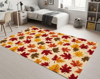 May include: Rectangular rug with a cream background and a pattern of autumn leaves in red, orange, yellow, and brown. The rug is on a light wooden floor in a bedroom. The rug's dimensions are in centimetres.