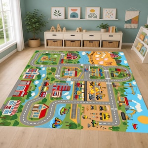 May include: A rectangular area rug featuring a colorful illustrated town map with roads, buildings like a fire station and school, a farm with animals, construction vehicles, and a railway track. The design includes green landscapes and blue sky.