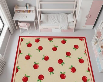 May include: A rectangular area rug with a cream-colored background and a repeating pattern of red apples with green leaves. The rug has a red border and is placed in a child's bedroom setting.