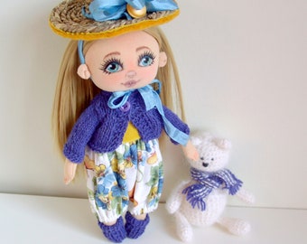 Handmade textile doll with bear