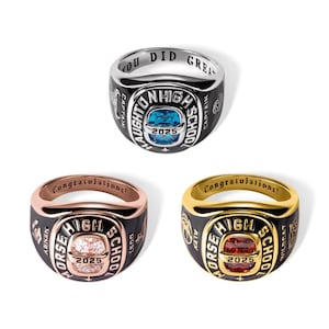 May include: Three class rings with black enamel and gold, rose gold, and silver bands. Each ring features a central gemstone and the year 2025. One ring says "You Did Great" and another says "Congratulations!"