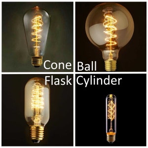 Puede incluir: Cuatro tipos diferentes de bombillas Edison: cono, bola, matraz y cilindro. Cada bombilla tiene un filamento en espiral y est&aacute; encendida.
