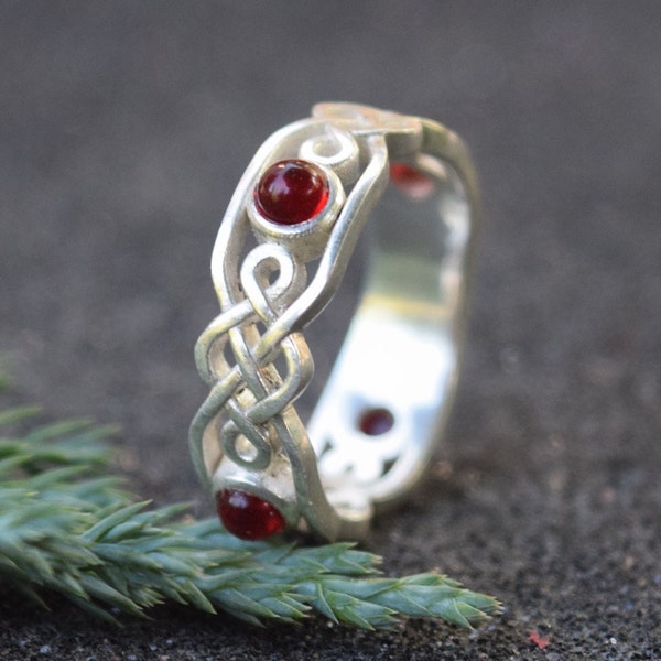 Elegant Sterling Silver Celtic Knot Ring with Garnet Accents,Timeless Symbol of Eternity