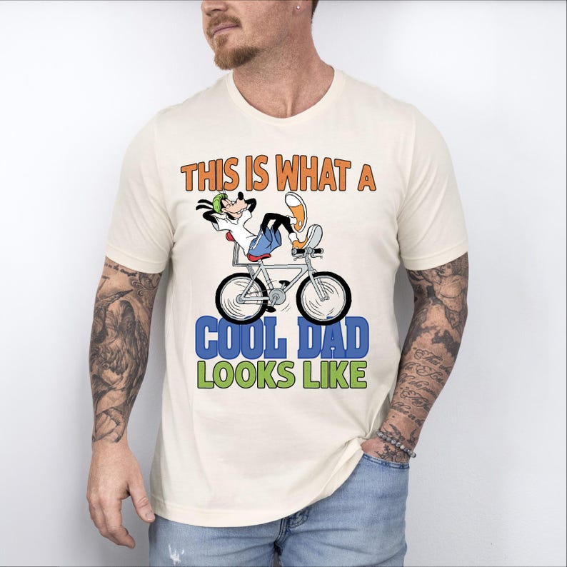 a man wearing a t - shirt that says, this is what a cool dad