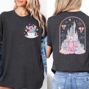 a woman wearing a black t-shirt with a graphic design on the front and back. The design on the front depicts a character from the Disney movie Lilo and Stitch, while the back of the t-shirt shows a castle and fireworks.