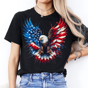 A woman wearing a black t-shirt with a graphic design of an eagle in flight, surrounded by the colors of the American flag.