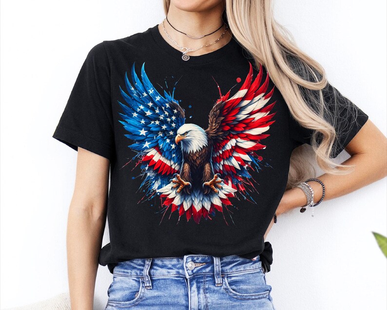 A woman wearing a black t-shirt with a graphic design of an eagle in flight, surrounded by the colors of the American flag.