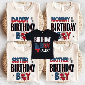 a collection of birthday t-shirts with the text "DADDY OF THE BIRTHDAY" and "MOMMY OF THE BIRTHDAY" printed on them, along with Spider-Man and Spider-Man logos. The t-shirts are arranged in a row, with one black t-shirt in the center featuring the text "BIRTHDAY ALEX".