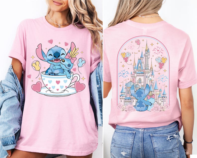 A woman wearing a pink t-shirt with a cartoon image of Stitch and her friends in a cup, along with a castle and fireworks in the background.