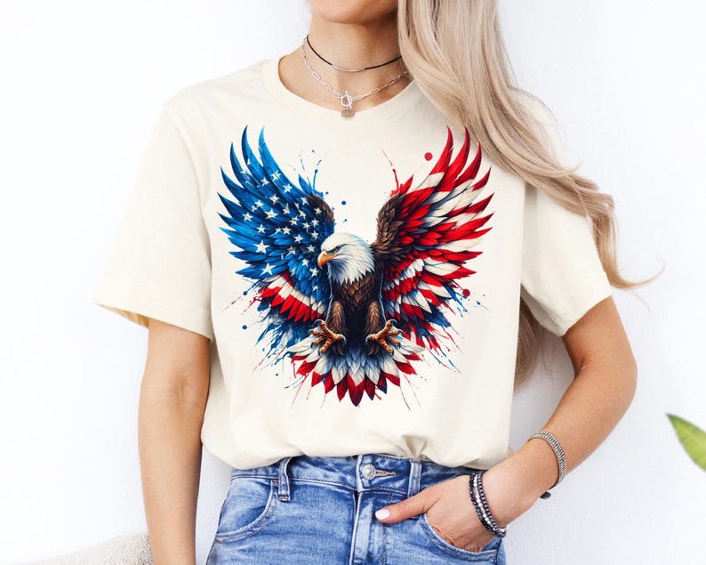 A woman wearing a white t-shirt with an American eagle design and jeans stands against a white background.