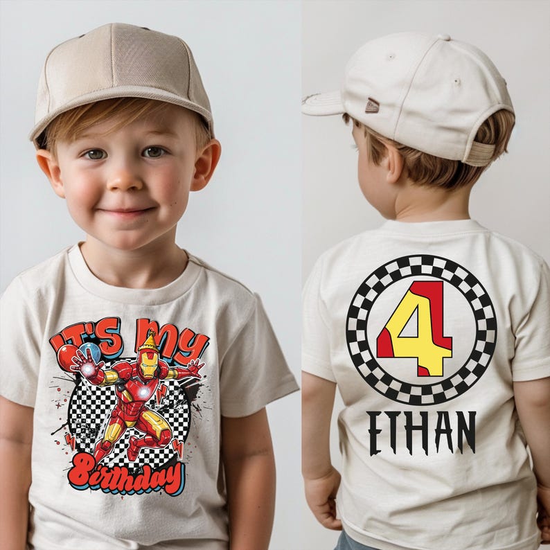 A young boy wearing a white t-shirt with a graphic design and text, including a character and the number 4.