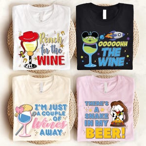 four t-shirts with different designs and text, including a red hat, a wine glass, a snake, and a beer mug.