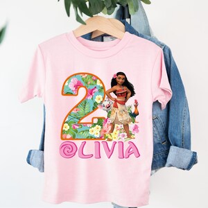 a pink shirt with a picture of a woman on it
