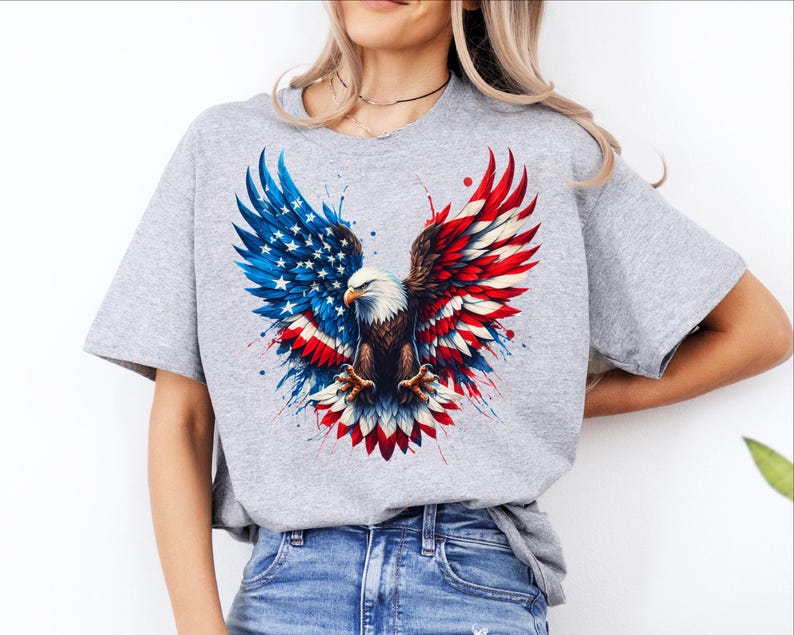 A woman wearing a gray t-shirt with an American eagle design and a flag pattern.