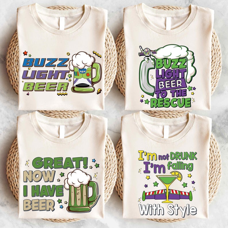 four white t-shirts with colorful and humorous text and graphics printed on them.