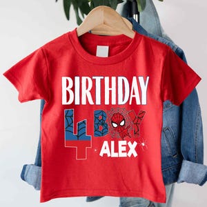A red t-shirt with the text "BIRTHDAY 4BOY ALEX" printed on it, along with a Spider-Man character graphic.