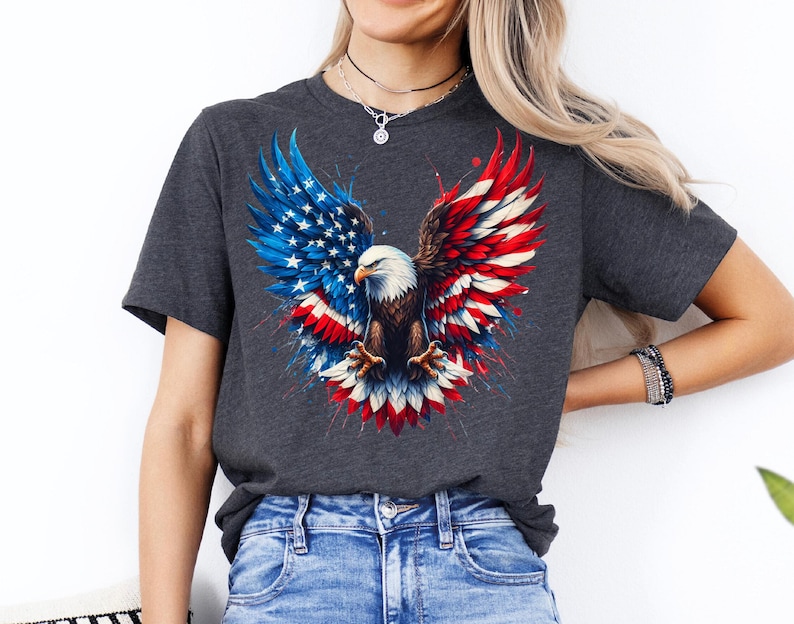 A woman wearing a gray t-shirt with an American eagle design and a necklace.