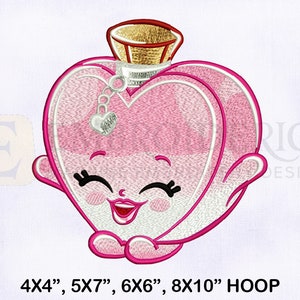 May include: Embroidered design of a pink heart-shaped perfume bottle with a smiling face. The bottle has a gold lid and a silver charm. The design is suitable for embroidery hoops measuring 4x4 inches, 5x7 inches, 6x6 inches, and 8x10 inches.
