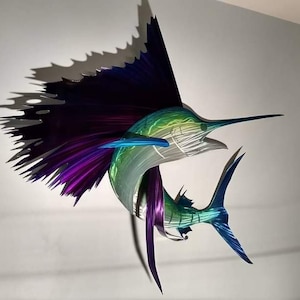 May include: A metal sculpture of a sailfish with a purple, blue, and green iridescent finish. The sailfish is leaping out of the water with its dorsal fin extended.