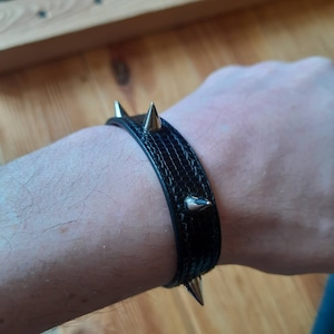 Black punk-rock bracelet with spikes. Luxury Gothic bracelet. Handmade bracelet on the arm.  Minimalist bracelet.