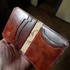 A compact, small shell cordovan and buttero leather vertical bifold wallet. Handmade cardholder.