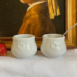 Two french apilco porcelain white cocotte dishes, embossed handles,  dishes, 3oz pots perfect condition, chocolate pots