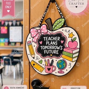 May include: An apple-shaped door sign featuring a black chalkboard center with the white text TEACHER PLANS TOMORROW'S FUTURE. The design includes a pink polka-dot bow, a pencil, a ruler, a globe, a mug with pens, and a stack of books.