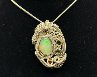 Ethiopian opal, hessonite garnet, & chrome tourmaline pendant