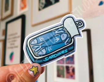 Pegatina troquelada de lata de sardinas acurrucadas