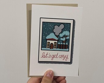 Tarjeta navideña Polaroid "Pongámonos cómodos"