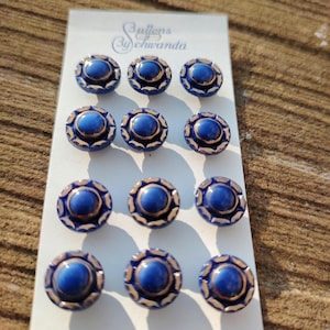 Jaren 50 glazen knopen blauw-goud van Schwanda op originele kaart