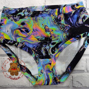 May include: Black underwear with a colorful abstract print resembling oil slicks. The print features swirls of blue, green, yellow, and pink.