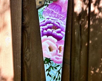 Beautiful hand painted floral on repurposed saw blade