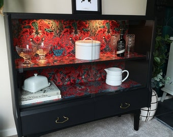 Black drinks bookcase buffet glazed cabinet with Emma Shipley Amazon wallpaper with rechargeable USB lights