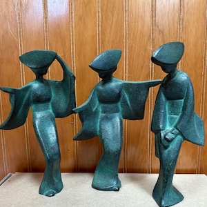A Mid Century set of 3 cast iron Geisha dancers.