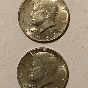Two-1964 50 CENT KENNEDY HALF dollars 90%  silver coin.