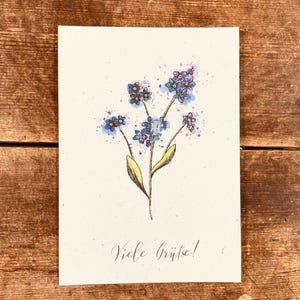 Carte avec des fleurs de myosotis (papier à graines)