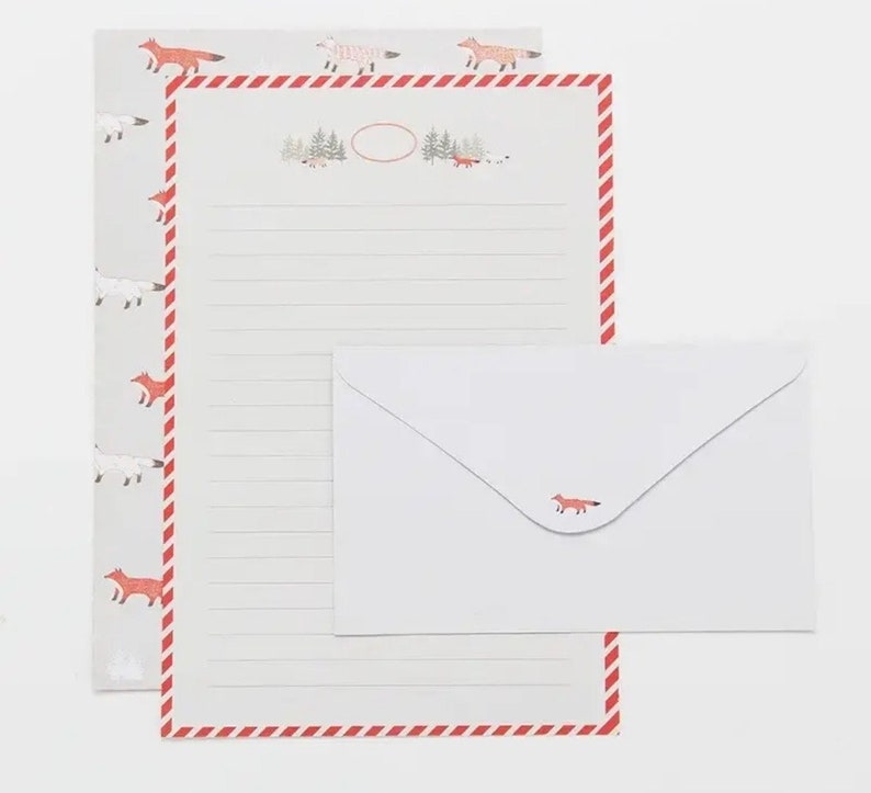 May include: A set of stationery featuring a red and white striped border with a repeating pattern of foxes and a white envelope with a single fox illustration.