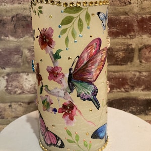 butterfly decorated flameless candle, flameless candle with butterflies and glass charms, butterfly lighted decor, butterfly lighted accents
