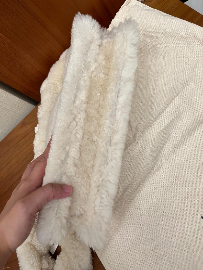 May include: A rustic wooden sign with the text "Welcome to our home" in white lettering. The sign features a distressed finish and a simple, inviting design, perfect for a front porch or entryway.