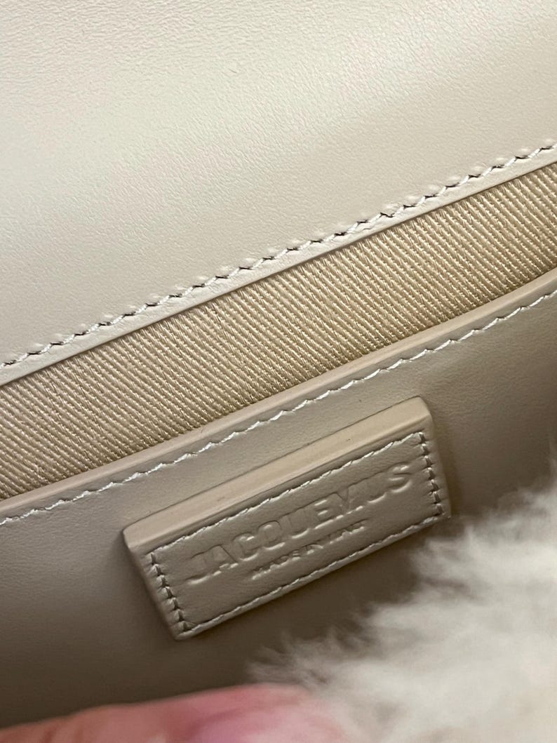 May include: A set of three ceramic mugs with a speckled, matte finish. The mugs are in shades of cream, light gray, and dark gray. Each mug has a simple, minimalist design and a rounded handle.