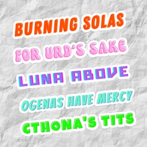 May include: Five colorful stickers with text on a white textured background. The stickers read "Burning Solas", "For Urd's Sake", "Luna Above", "Ogenas Have Mercy", and "Cthona's Tits".