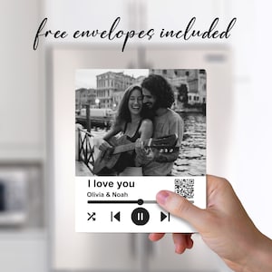 May include: Black and white photo of a couple playing guitar in Venice, Italy. The photo is on a white background with a music player design and the text "I love you Olivia & Noah".