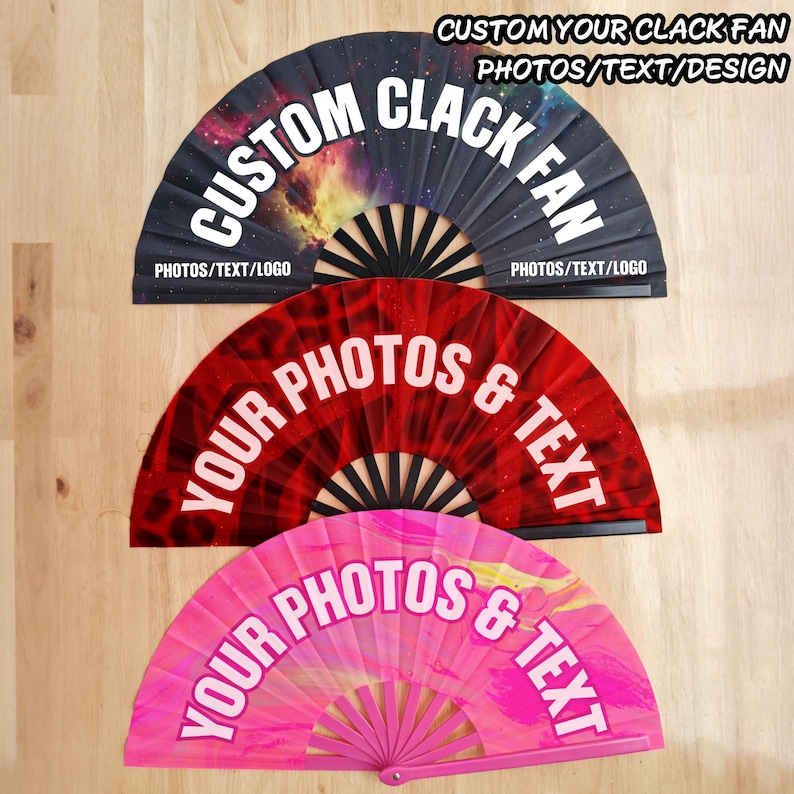 May include: Three folding hand fans displayed in a vertical row. The top fan features a galaxy print with the text CUSTOM CLACK FAN. The middle fan is red with the text YOUR PHOTOS & TEXT. The bottom fan is pink with the text YOUR PHOTOS & TEXT.