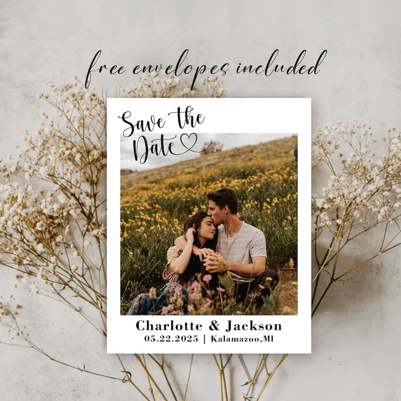 May include: Save the Date card featuring a photograph of a couple in a field of yellow flowers. The text reads "Save the Date" with a heart symbol and "Charlotte & Jackson" with the date "05.22.2025" and location "Kalamazoo, MI".